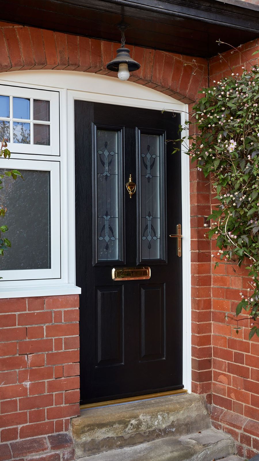 Classic black composite front door with decorative etched glass