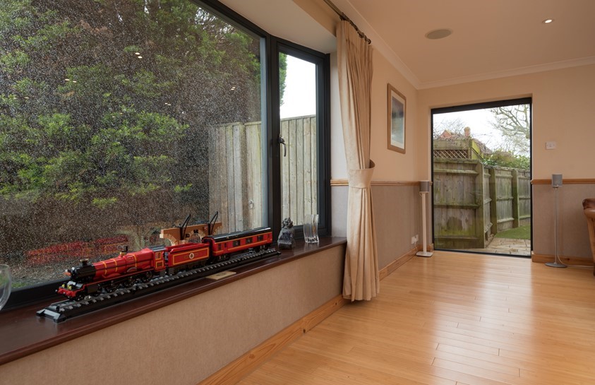 Slim aluminium picture window overlooking a garden