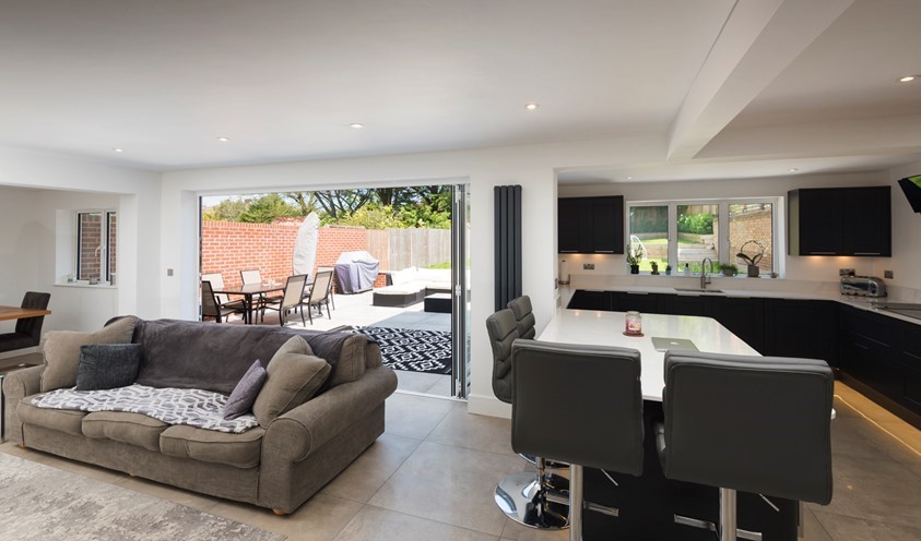 Aluminium bifold doors from a kitchen-diner in Royal Wootton Bassett