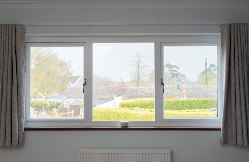 Contemporary aluminium picture window in a living room in Hungerford