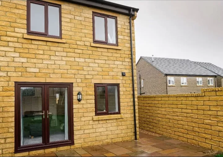 Rosewood French doors and matching windows on a Cotswold stone house, Brockworth