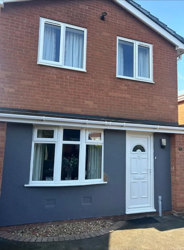 White casement windows and a white bay window on a red brick house, Abingdon