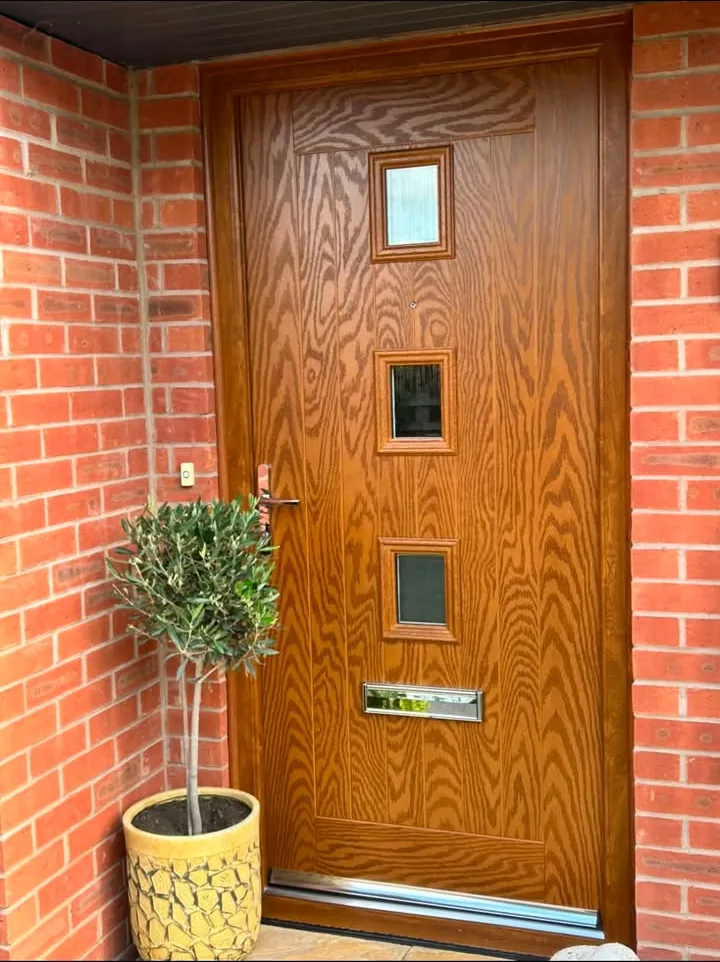 Oak-effect composite front door with three square glazed panels and a chrome letterplate, Innsworth, Gloucester