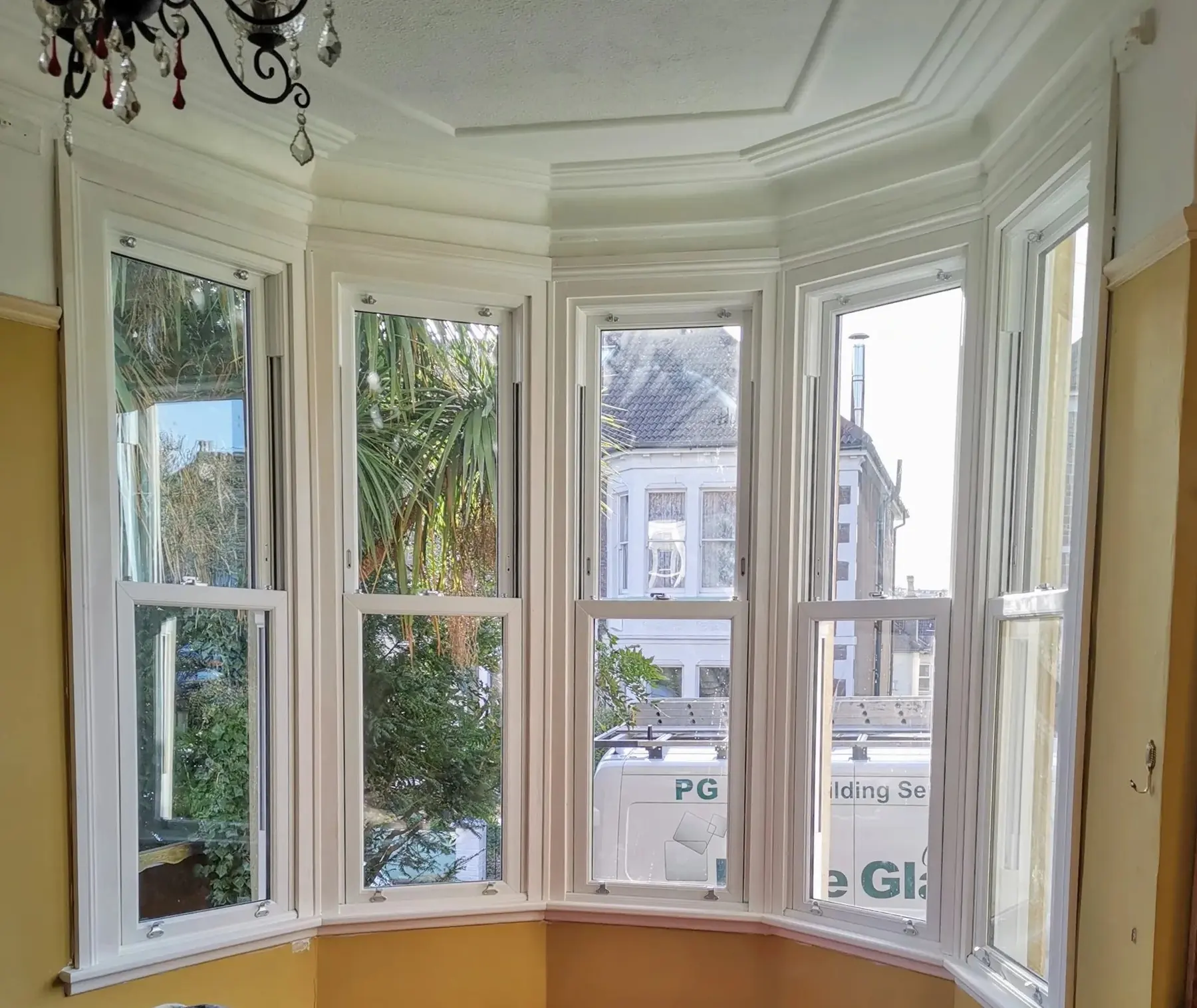 Interior of a white five-part sliding sash bay window
