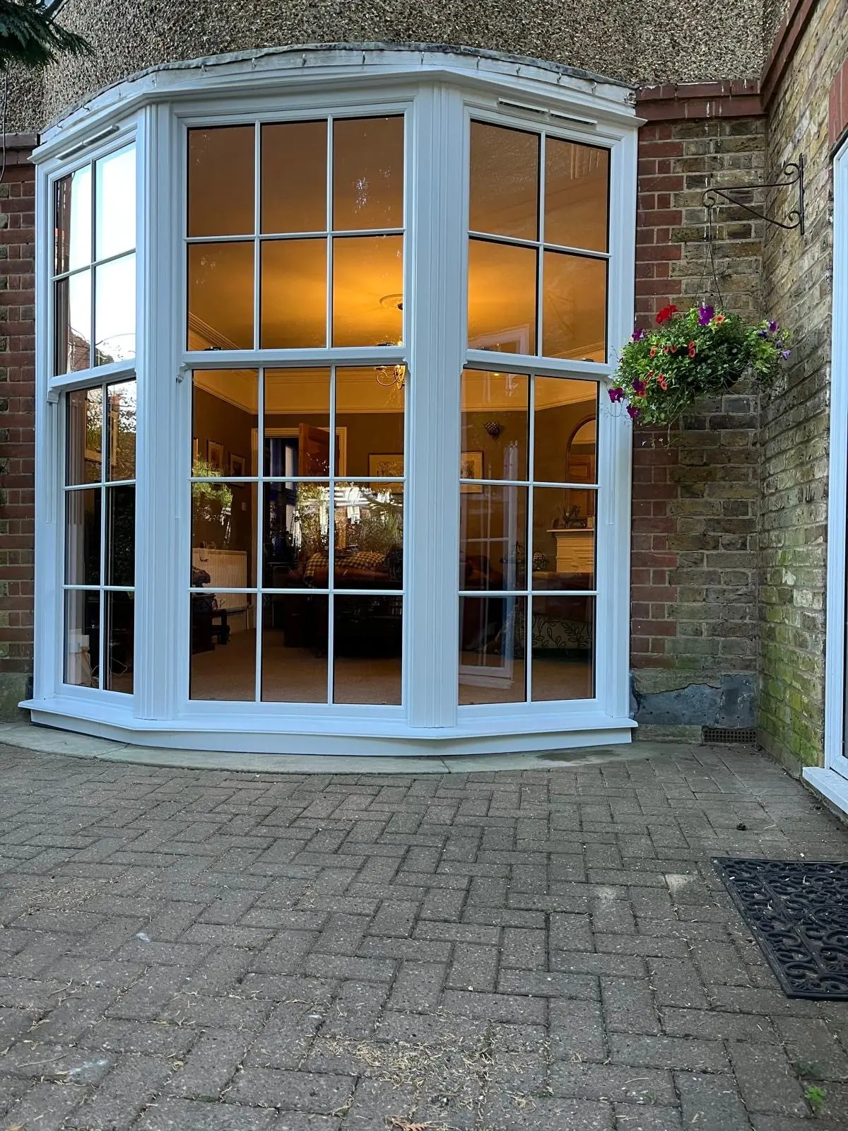 White sliding sash bay window with Georgian bars